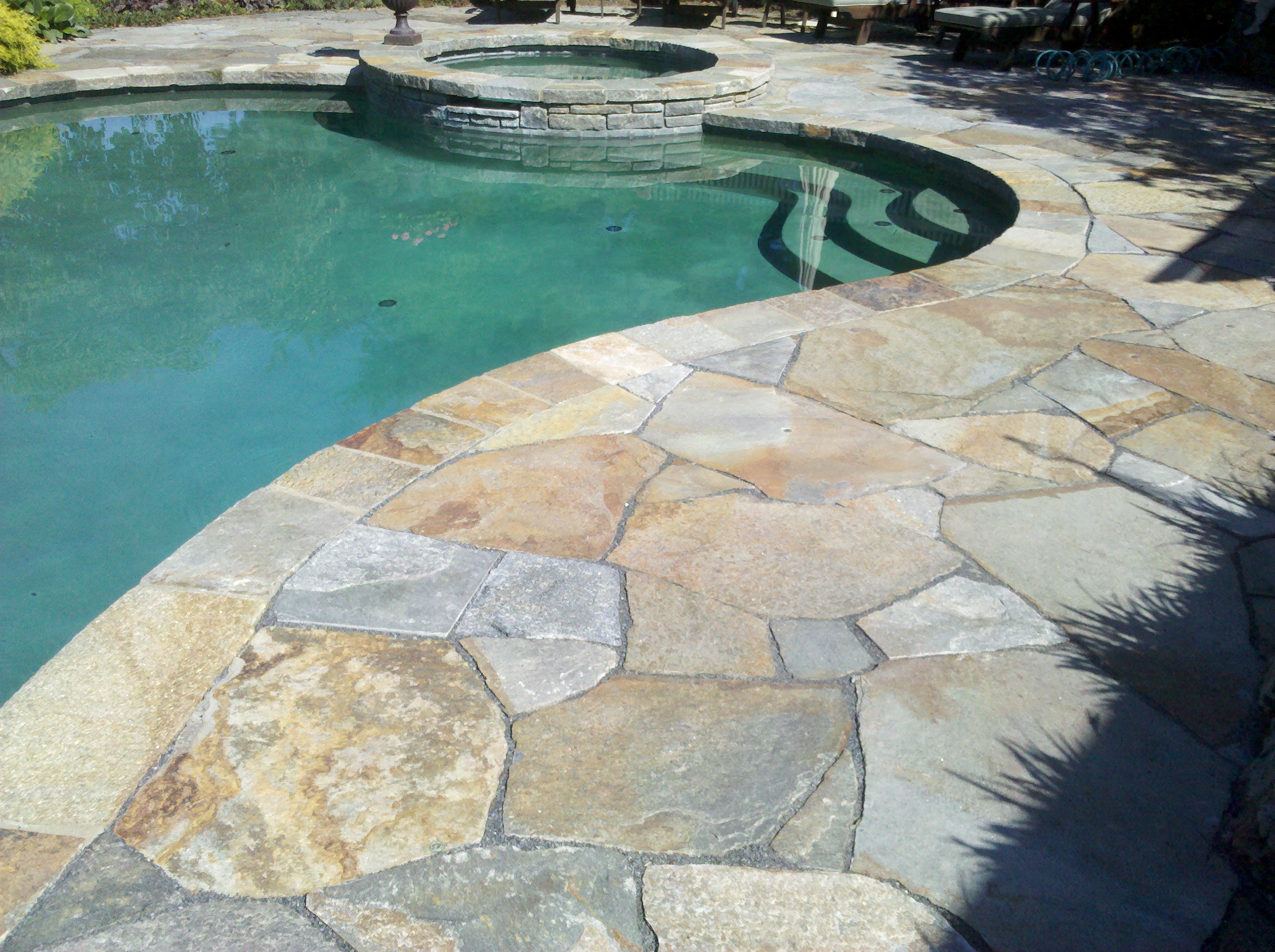 Stone masonry repair needed on this pool deck and patio. Masonry ...